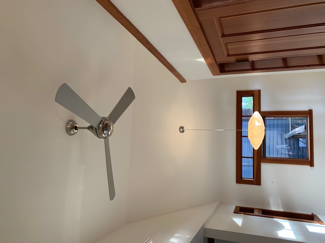 Vaulted ceiling, ceiling fan, and fir trim